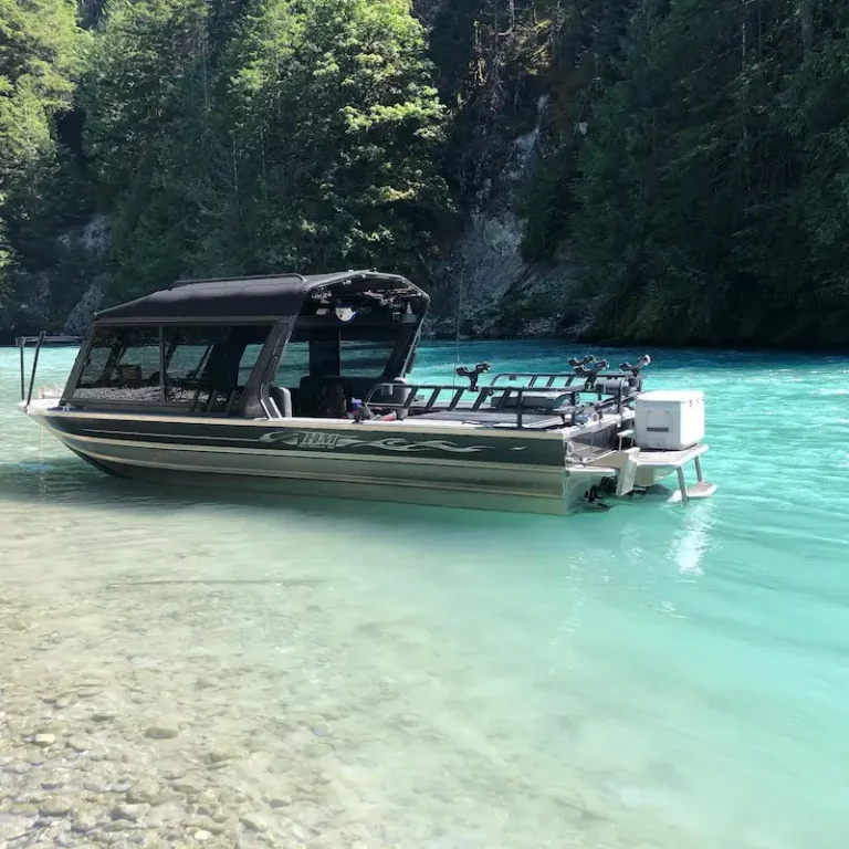 Fishing boat docked in crystal-clear turquoise waters, perfect for a serene sturgeon fishing experience