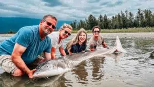 Family fishing for sturgeon on the Fraser River