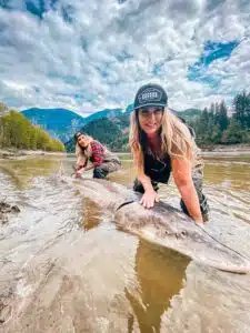 Ladies with their massive sturgeon